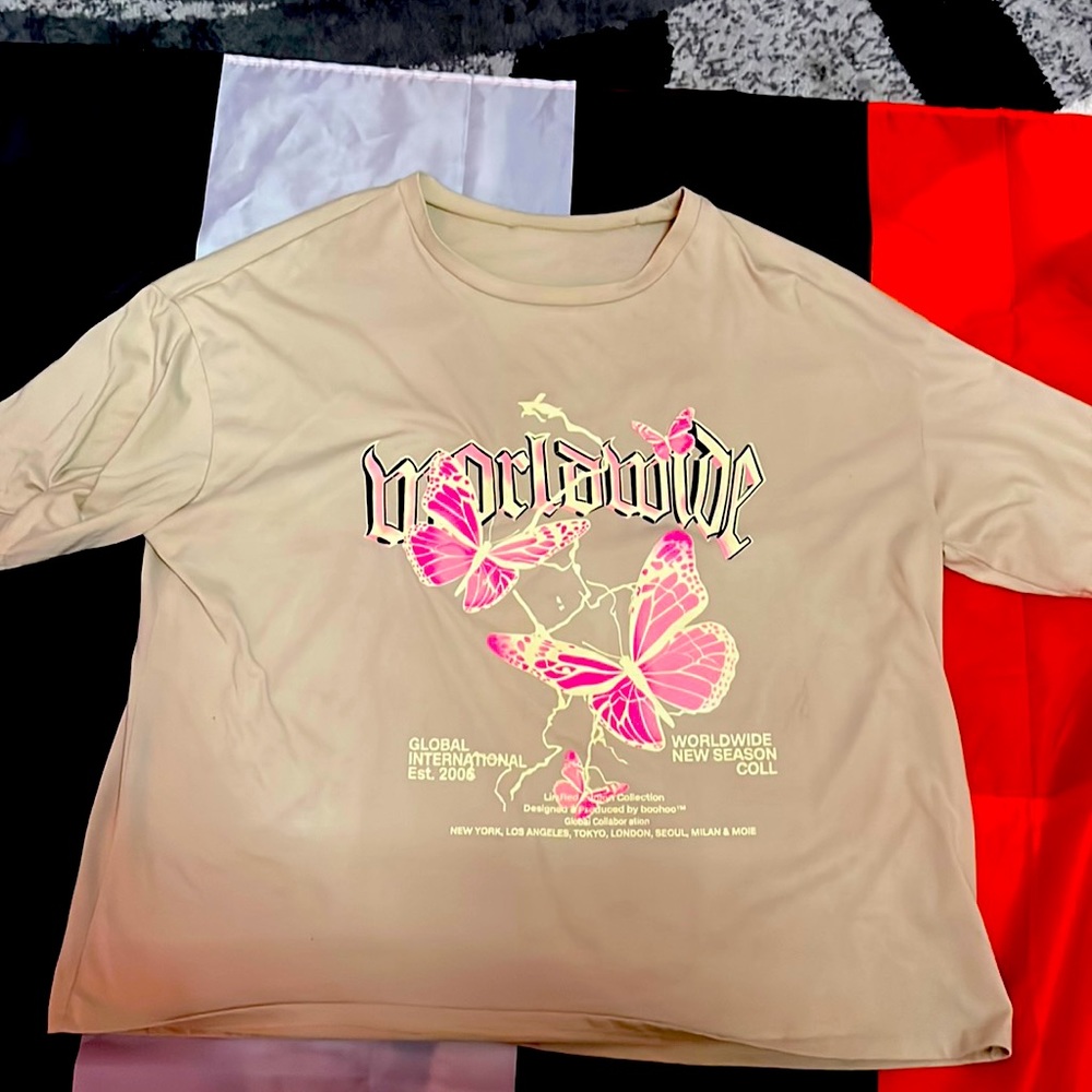beige shirt with butterfly designs